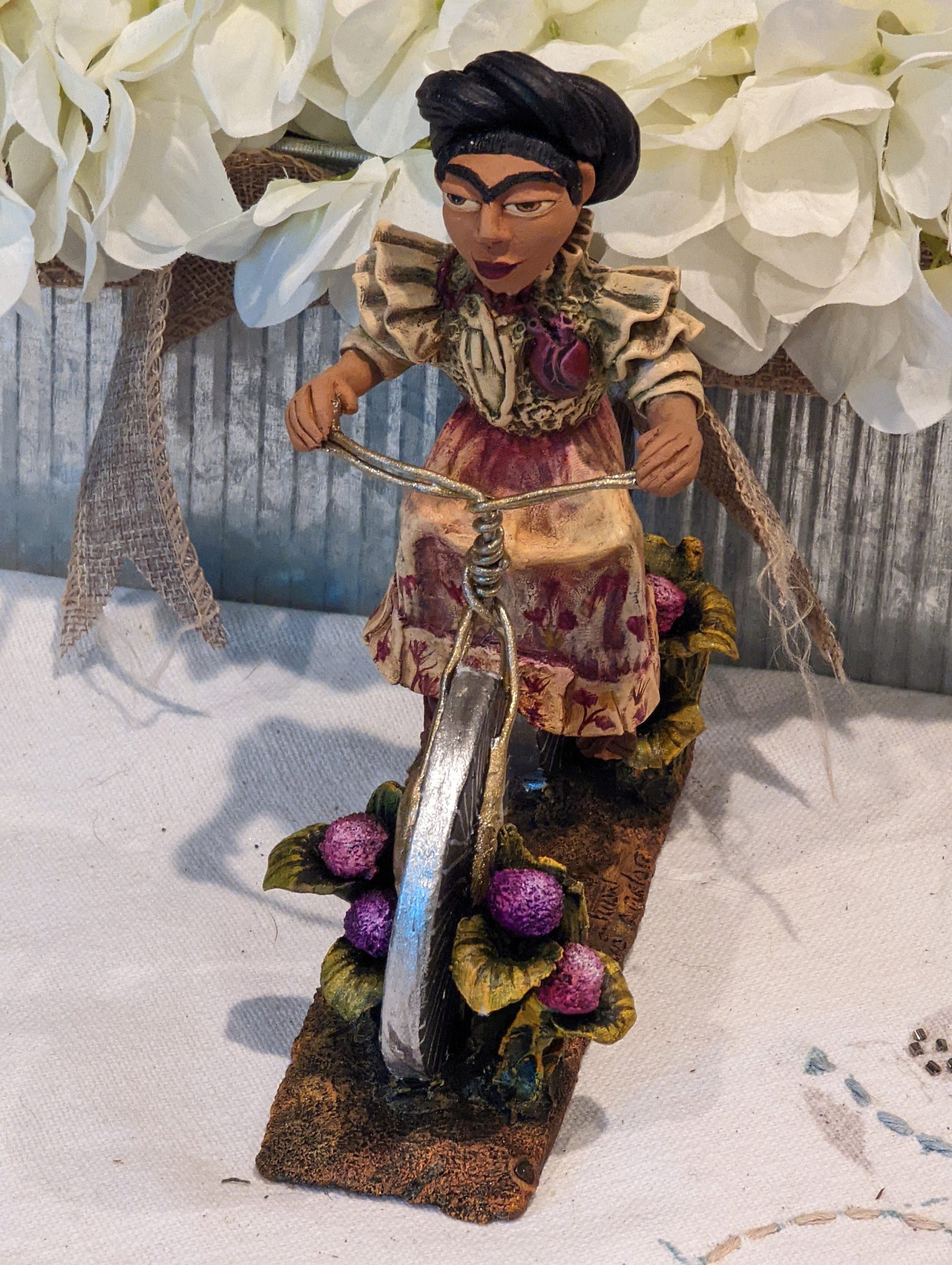 a-place-for-all-your-needs-to-get-oaxacan-woman-on-bicycle-mexican-folk-art-from-oaxaca-clay-figurine-handmade-by-juan-jose-aguilar-collectible-women-statuette-fashion_2.jpg