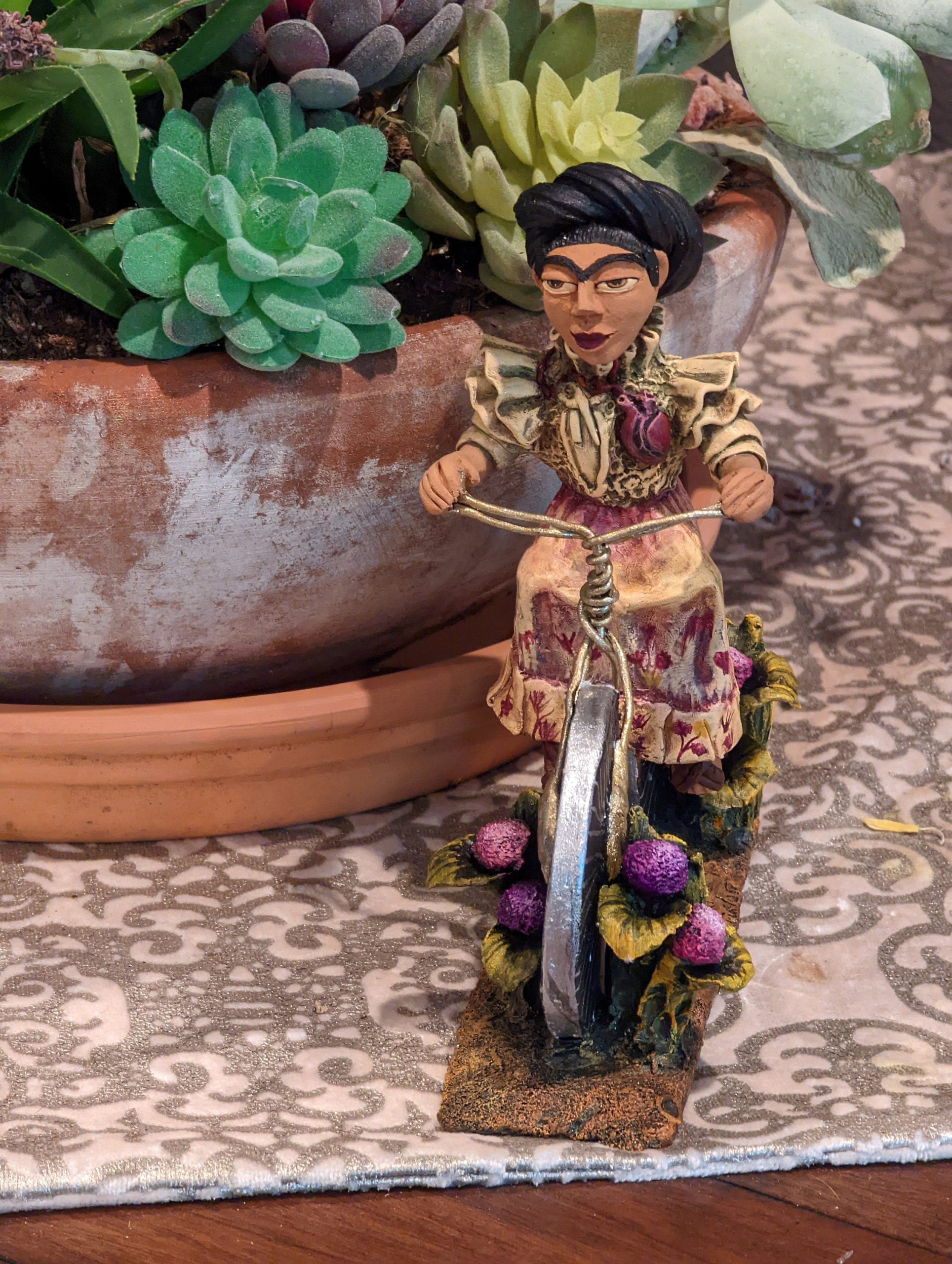 a-place-for-all-your-needs-to-get-oaxacan-woman-on-bicycle-mexican-folk-art-from-oaxaca-clay-figurine-handmade-by-juan-jose-aguilar-collectible-women-statuette-fashion_4.jpg